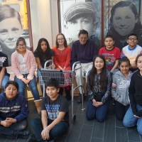 Steve with students from Arthur Smith Elementary in March 2019. A childhood photo of him is in the window to the left.