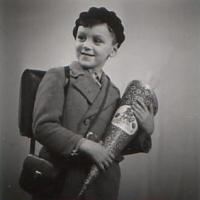 Steve as a child in Berlin, holding a Schultüte to mark his first day of school. Berlin, 1936.