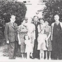 The Rindler and Fink families in front of Lord and Lady Cotesloe's house in Swanborne, England. Circa 1939.