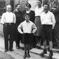 Fred, nine years old, with his father, Moritz (far left), mother, Erna (above Fred), and brother Eric (right front). Laubenheim, Germany. 1933.