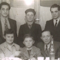  Josh (seated between his parents), and his brother Morris (above Josh), Foehrenwald, 1948.