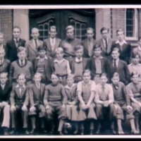 Class photo school in Copenhagen, 15 years old, 3rd sitting from right, wearing tie, 1936.