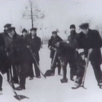 Family of Mel, shoveling snow on the highway for Germans.