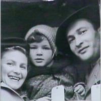 with son and husband in 1950 on boat arriving in new York